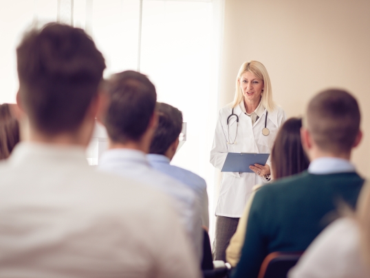 Doctor briefing students