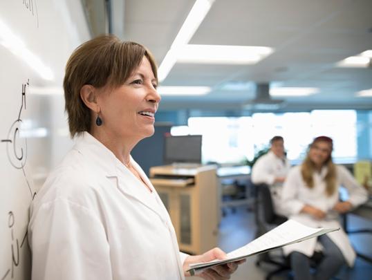 female doctor lecturing classroom