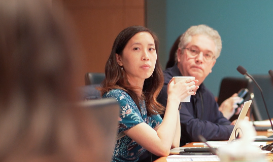 two members of creative community sitting at table