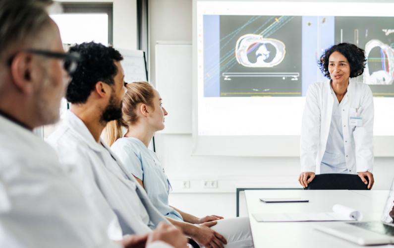 Researchers in a room having a discussion