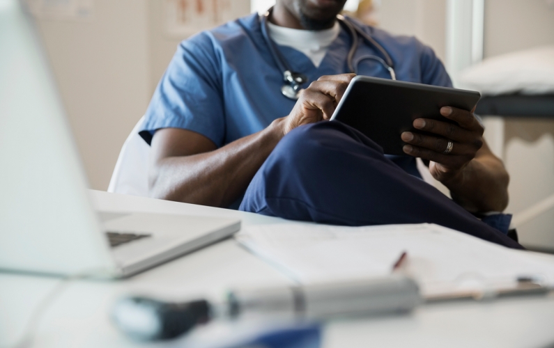 Doctor working on tablet