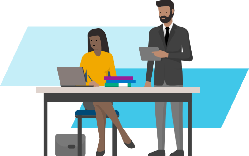 two researchers standing at a desk