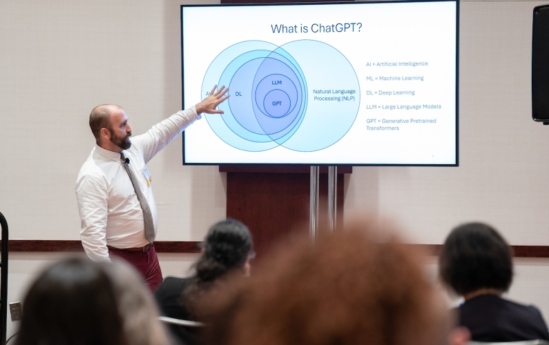 Man presenting on usage of ChatGPT and AI resources.