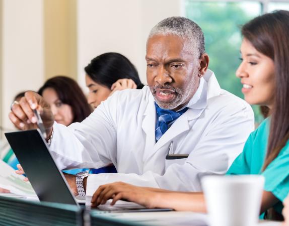 Doctors looking at computer