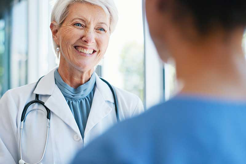 Academic dean speaking to a medical student