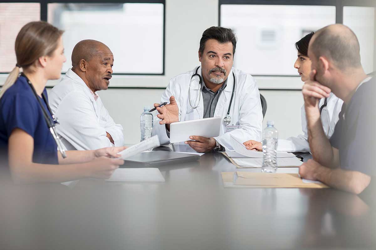 doctor-reviewing-assessmentsl Doctor reviewing assessments